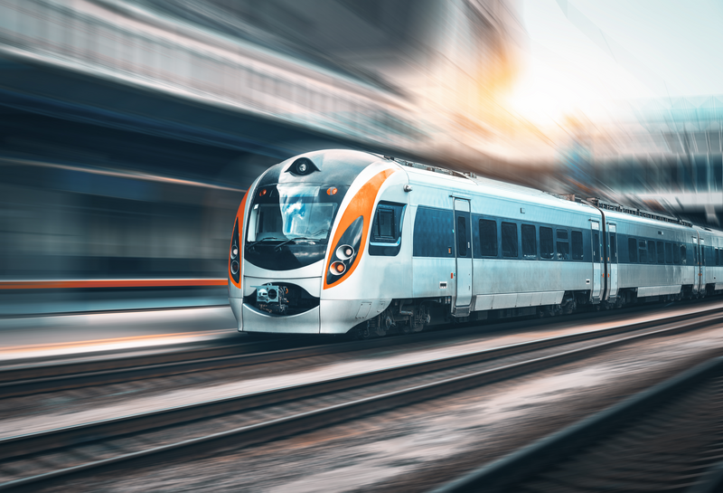 Orange and silver high speed commuter rail train using Industrial Wireless Technology for Railway Systems.