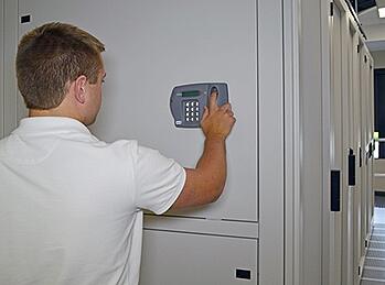 Data Center Technician Entering Security Keypad
