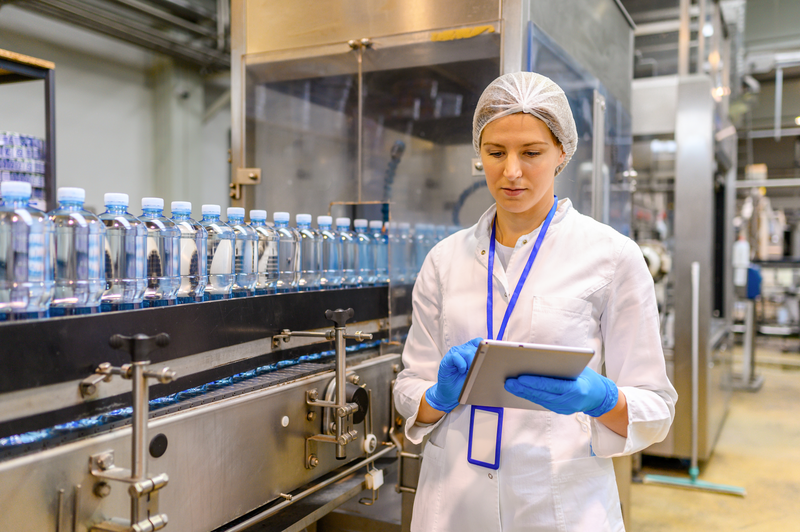 female engineer working on maintenance in bottling plant