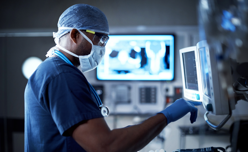 Female radiologist analysing the MRI image of the head