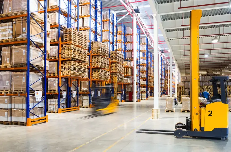 large modern warehouse with forklifts