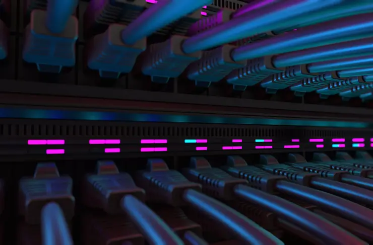 Close-up View of Modern Internet Network Switch With Plugged Ethernet Cables. Blinking Lights on Internet Server. Concept of Data Center, Cloud Computing and Telecommunications.