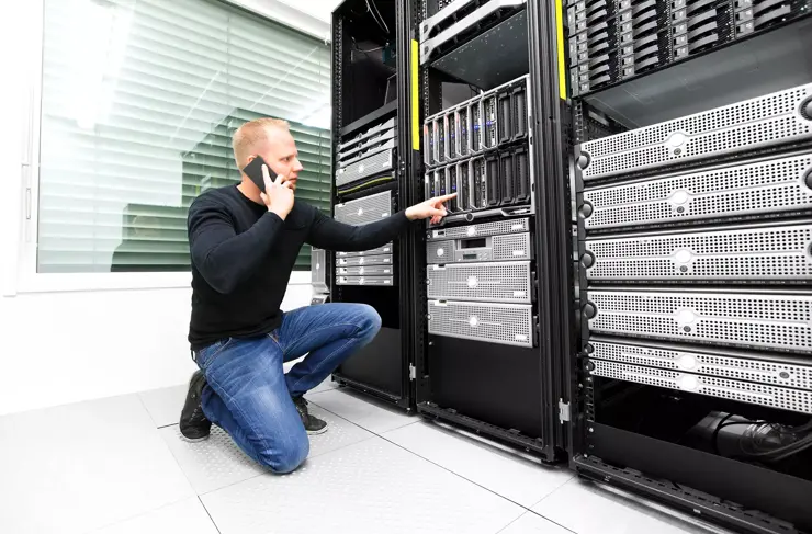 Data Center Technician Working on Servers