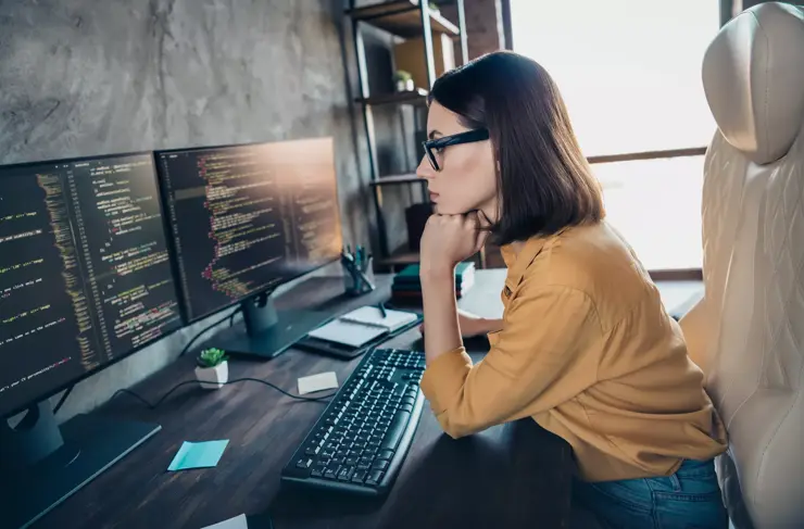 Profile side view portrait of attractive clever focused girl cyber engineer analyzing html process service at workplace workstation indoors