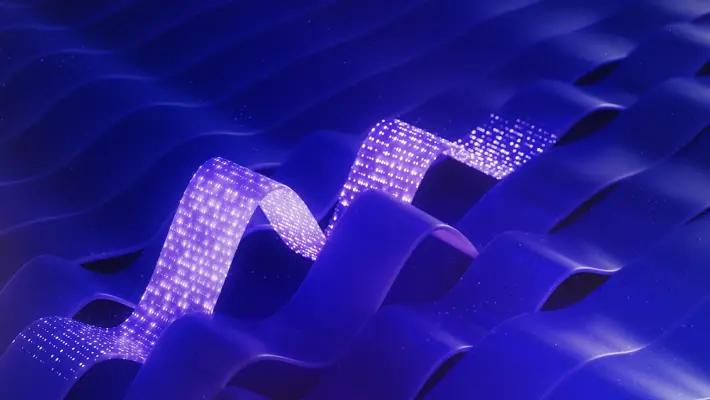 Blue abstract background with light traveling through abstract flat cable illustrating data flow (3D render)