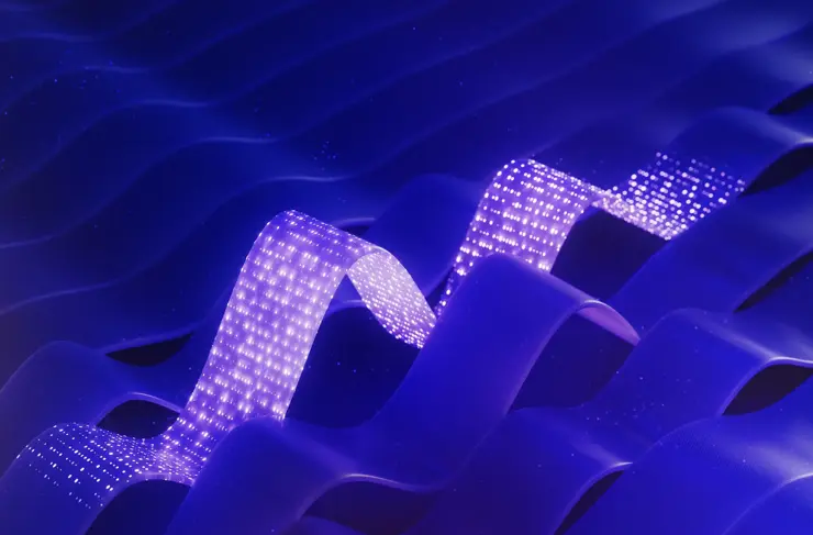 Blue abstract background with light traveling through abstract flat cable illustrating data flow (3D render)