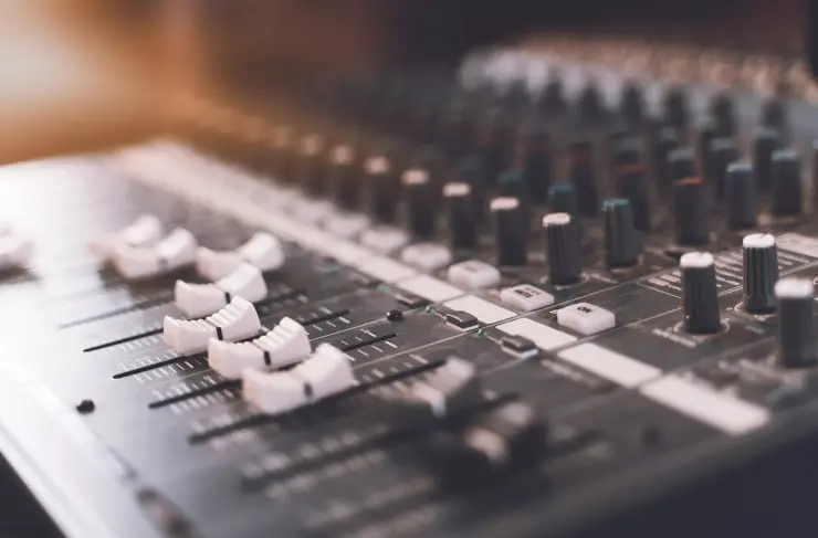 Sound mixer. Professional audio mixing console with lights, buttons, faders and sliders.