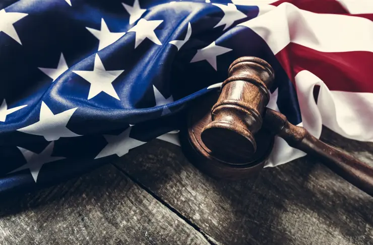Wooden gavel and USA flag