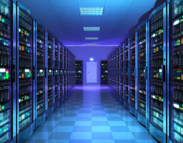 Remote-monitored data center, minimal lighting, wall-to-wall black server cabinets  & networking equipment