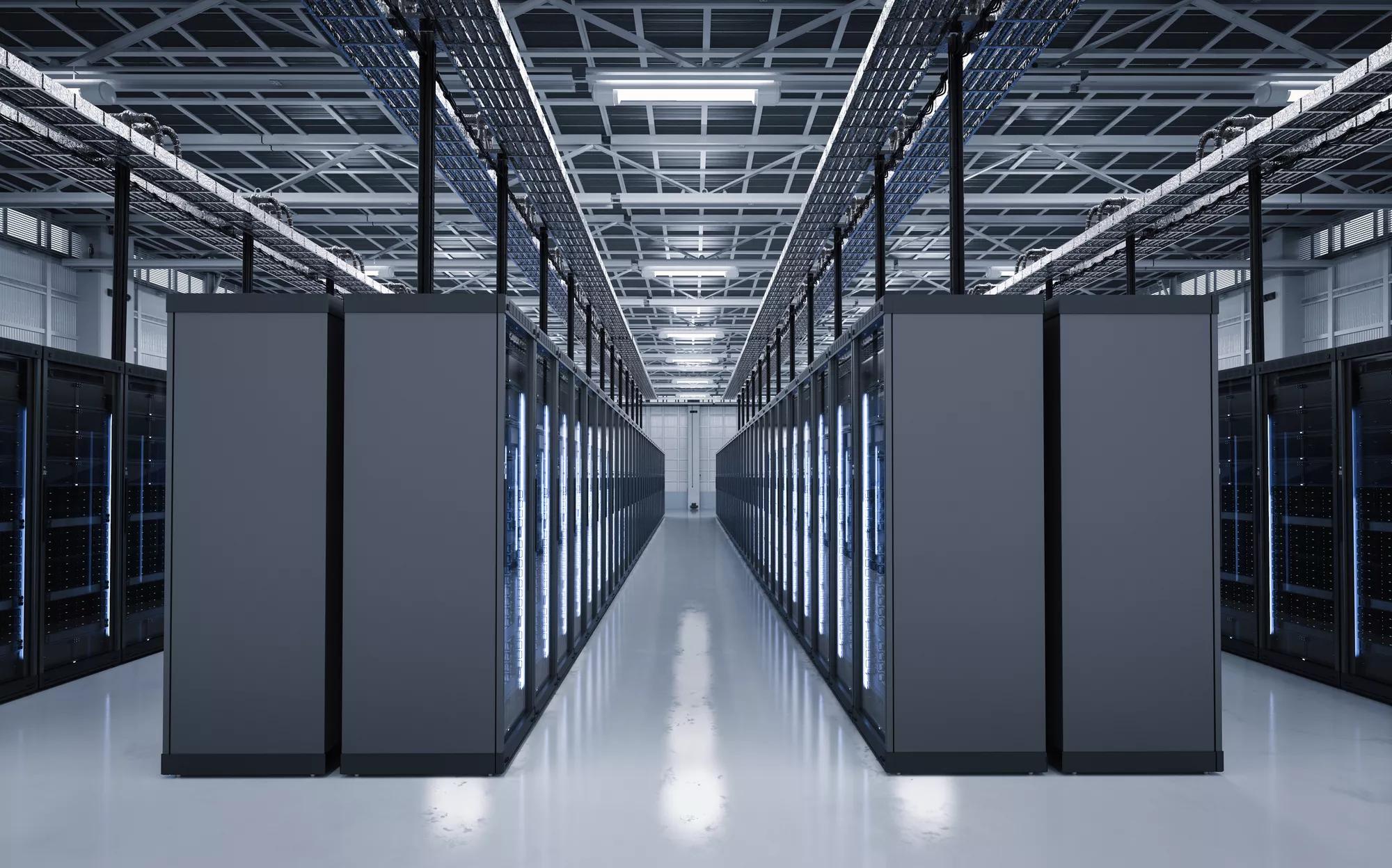 Data center, rows with black server cabinets with zone lighting & drop-away ceiling