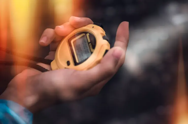 Hand Holding Digital Chronometer for Counting a Time