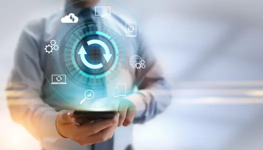 Remote management icons in circular motion extends over man with tablet maintaining uptime 