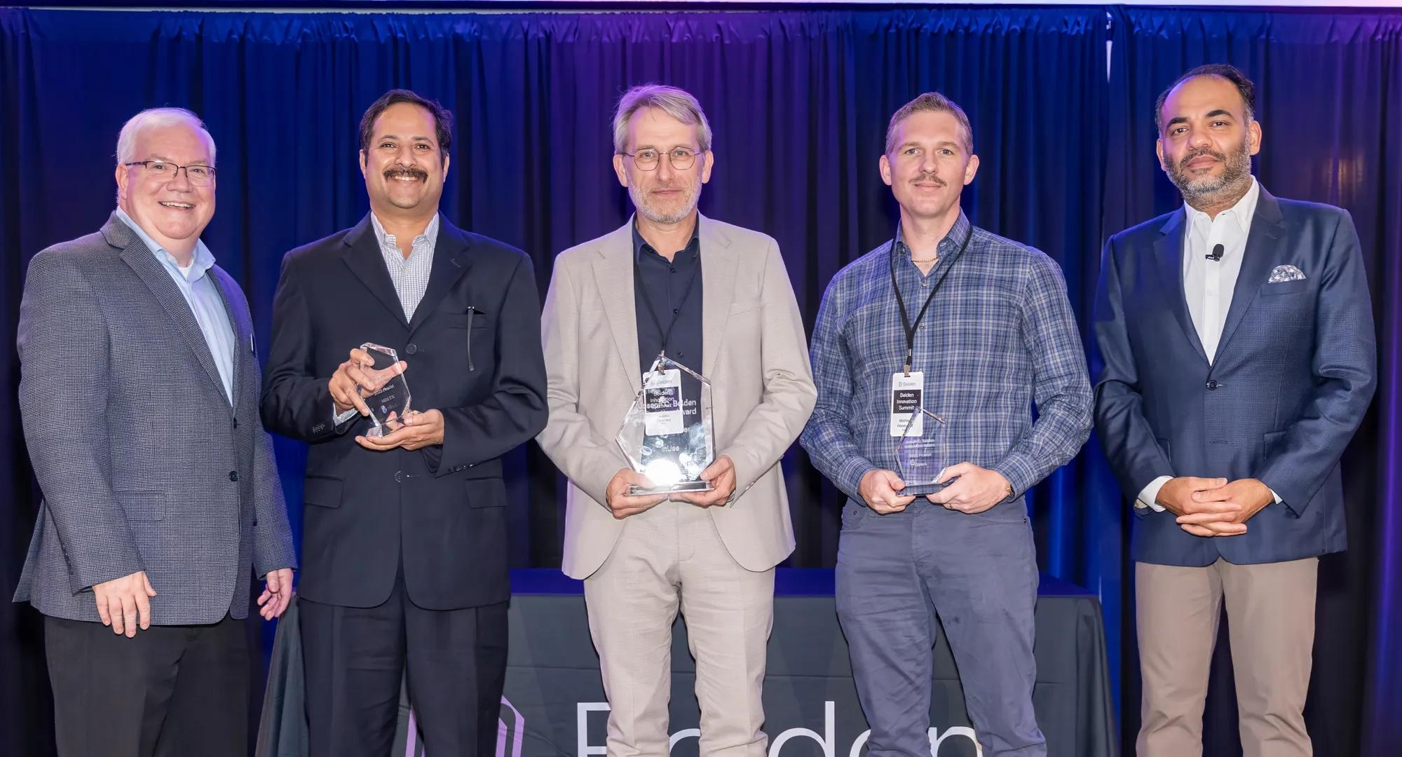 The group shot includes both finalists and the winner. (Left to right: Martin Van Der Burgt, Vice President, R&D - Data Acquisition and Transmission Products, Belden Inc.; Sharath Tadepalli, Principal Data Scientist at HGS; Laurent Couillard, Founder & CEO at InUse (Winner); Michael Honeycutt, Product Marketing Manager at Corero; Ashish Chand, President and Chief Executive Officer, Belden)