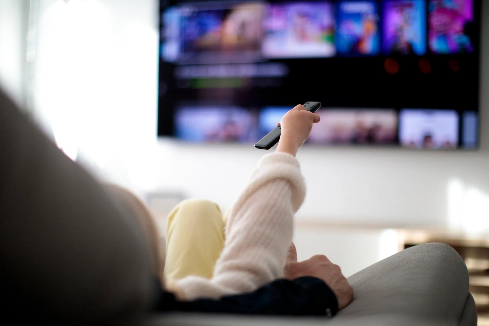 Family watching TV at home