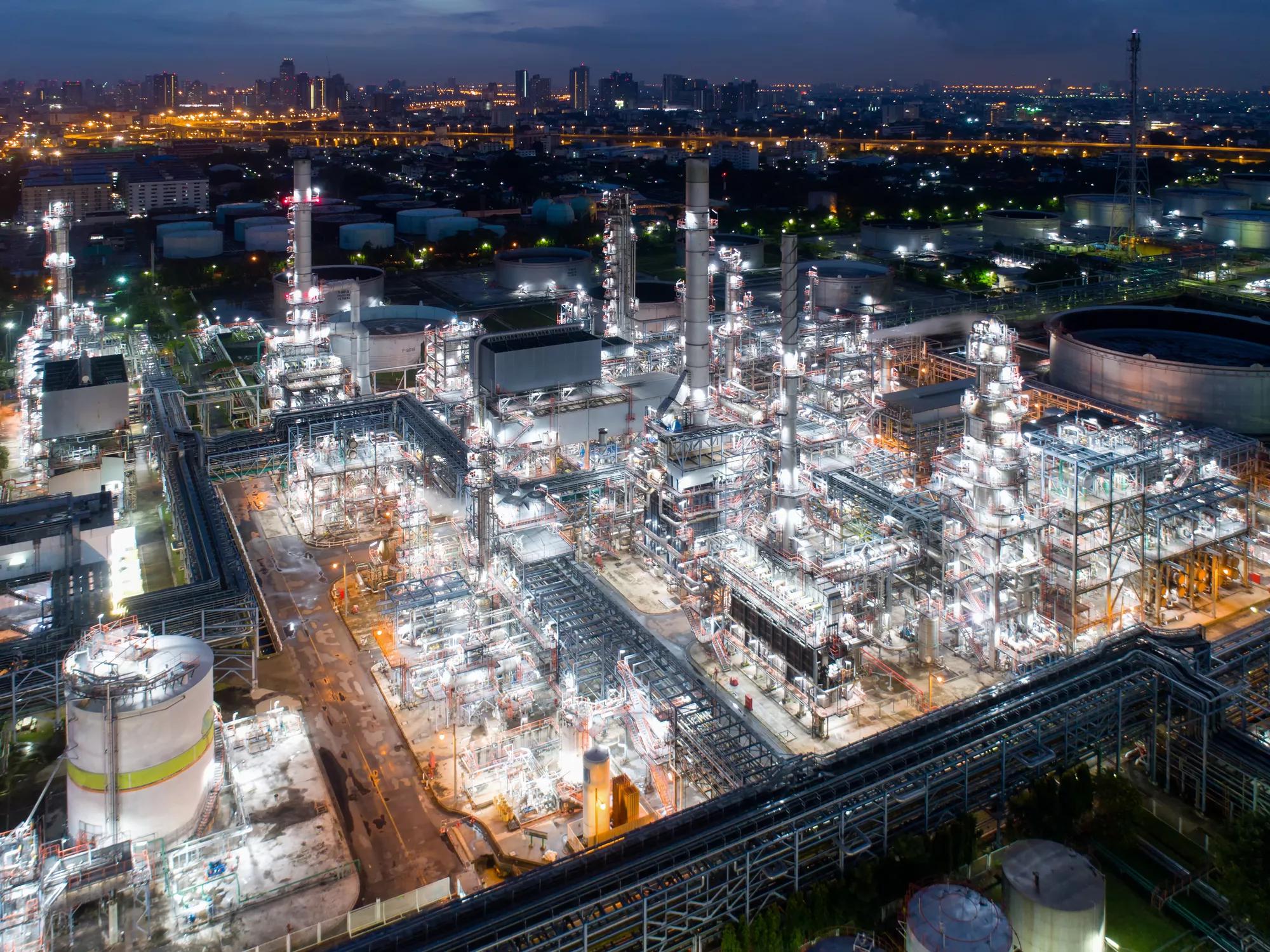 Aerial view of twilight of oil refinery ,Shot from drone of Oil refinery and Petrochemical plant at dusk , Bangkok, Thailand