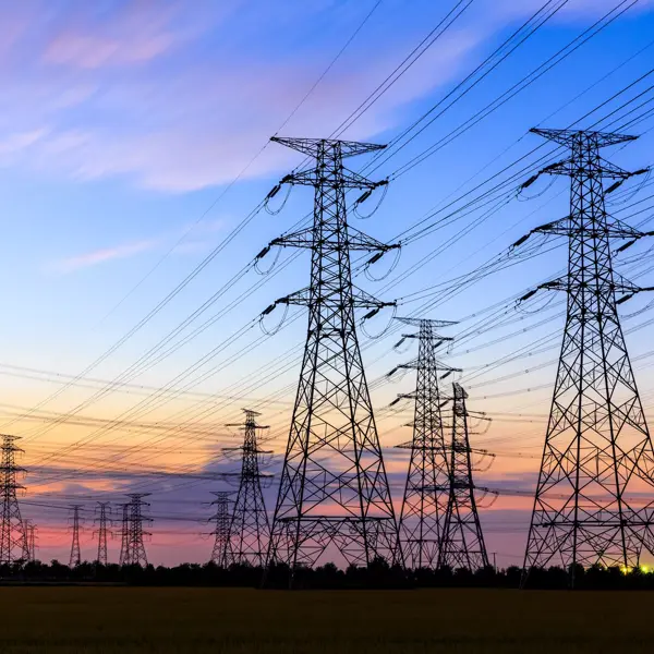 high-voltage power lines at sunset,high voltage electric transmission tower