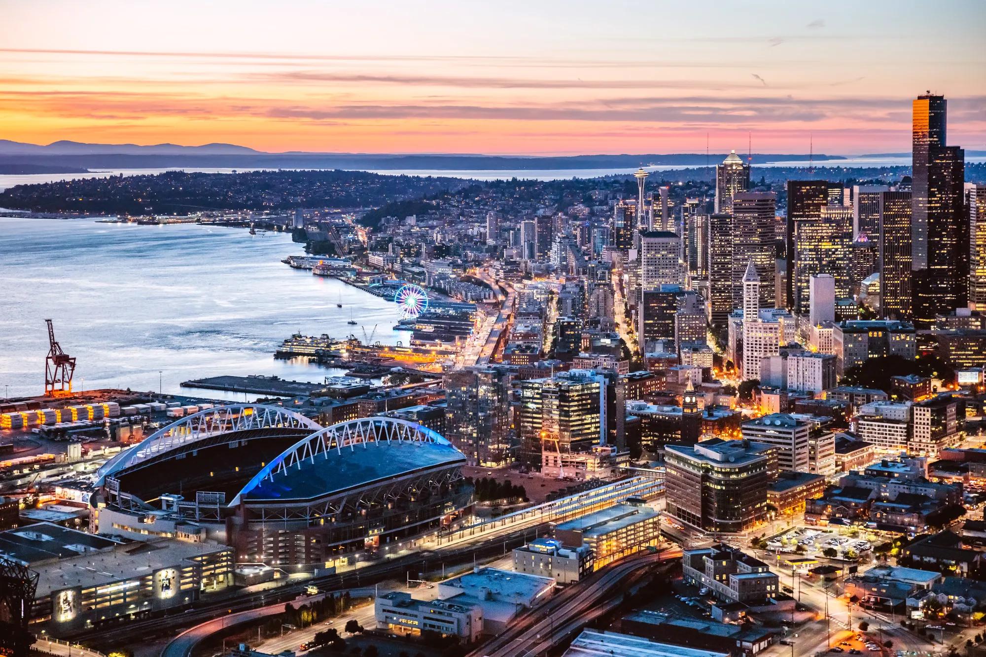 Aerial view of Seattle downtown and harbor at dusk, USA