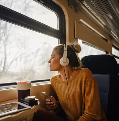 young woman riding a train