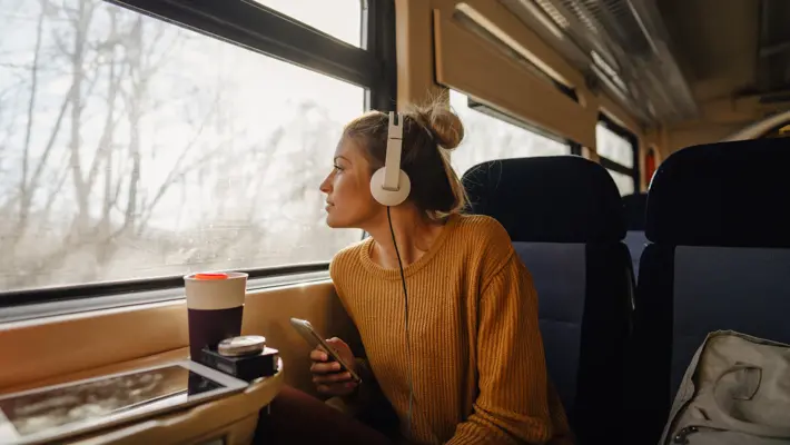young woman riding a train