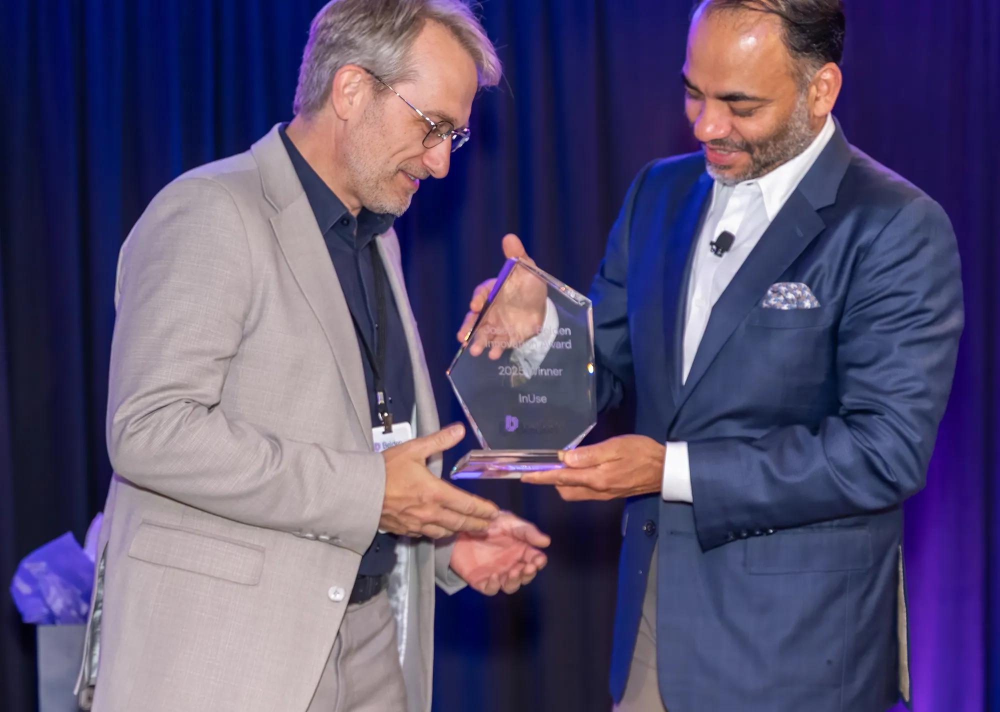 InUse's Laurent Couillard accepting Innovation Award from Belden CEO Ashish Chand
