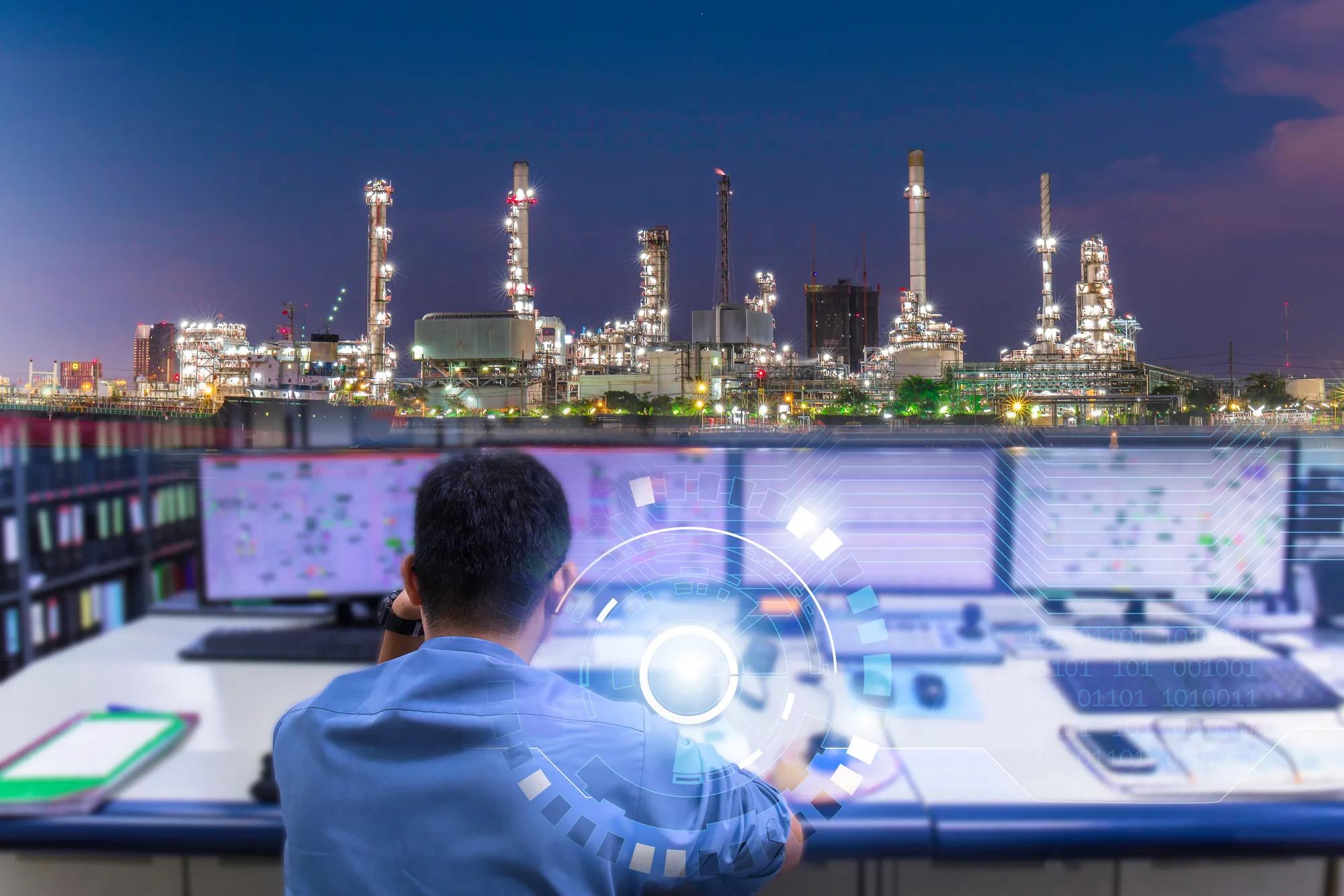 Double exposure of Engineering works with the tablet in the production control room.Control room of a steam Turbine,Generators, Oil refinery industry plant for monitor process, business and industry