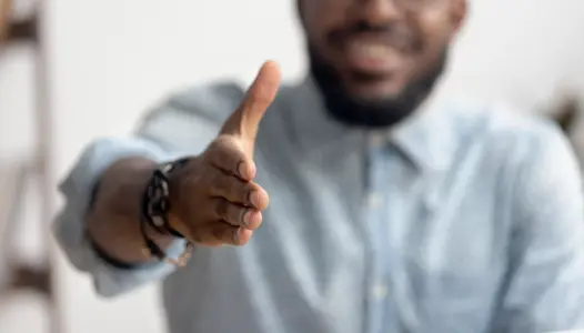 African american black professional business man hr recruiter consultant extending hand at camera for handshake concept greeting offering cooperation, welcoming at job interview, close up view