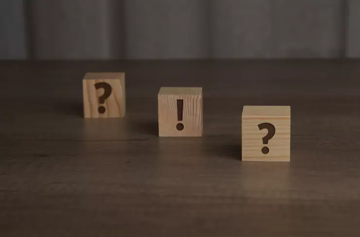 Wooden cubes with a question and exclamation mark on them. Can be used as concept