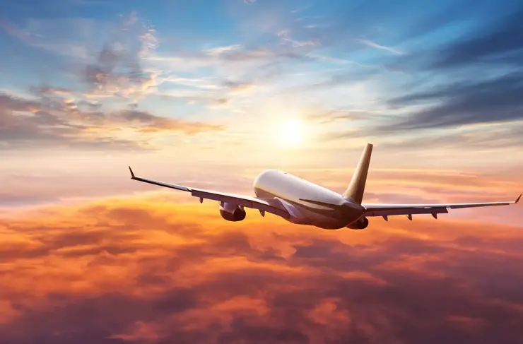airplane-taking-off-sunset-stock-hero-image