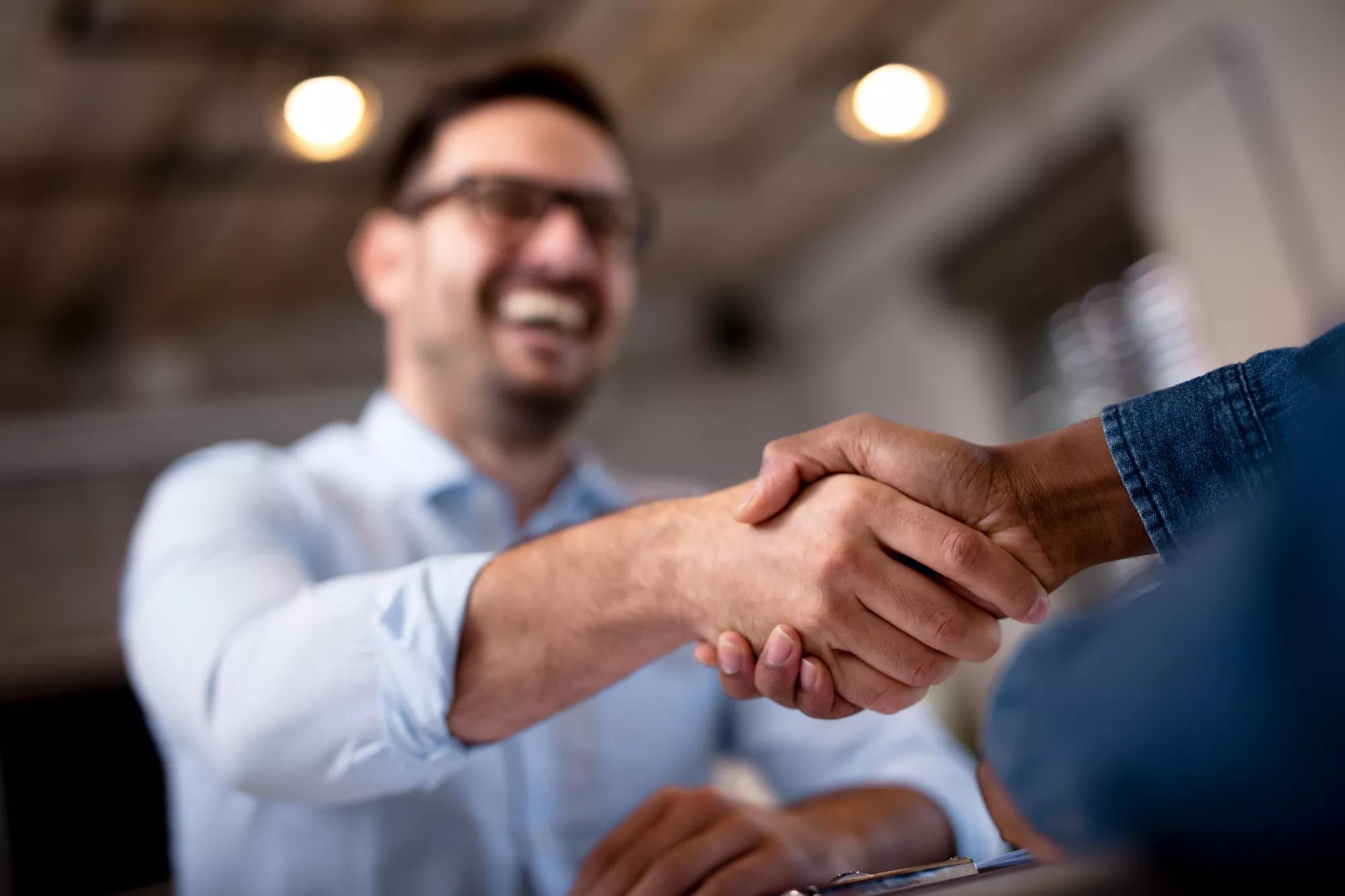 business people shaking hands.