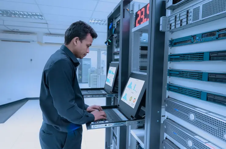 Network administrator working in data center room
