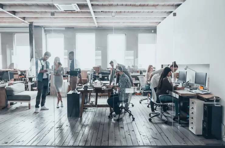 Team at work. Group of young business people in smart casual wear working together in creative office