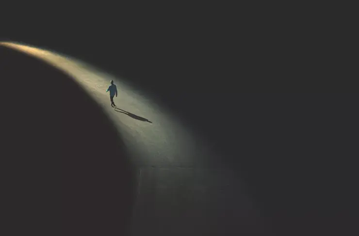 Lone-Individual-Walking-by-Street-Light
