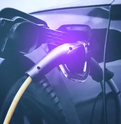 electric car charging at power station