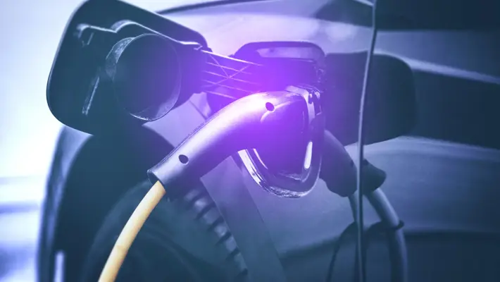 electric car charging at power station