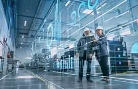 Factory Digitalization: Two Industrial Engineers Use Tablet Computer, Visualize the Wall of Big Data Statistics, Optimization of High-Tech Electronics Facility. Industry 4.0 Machinery Production