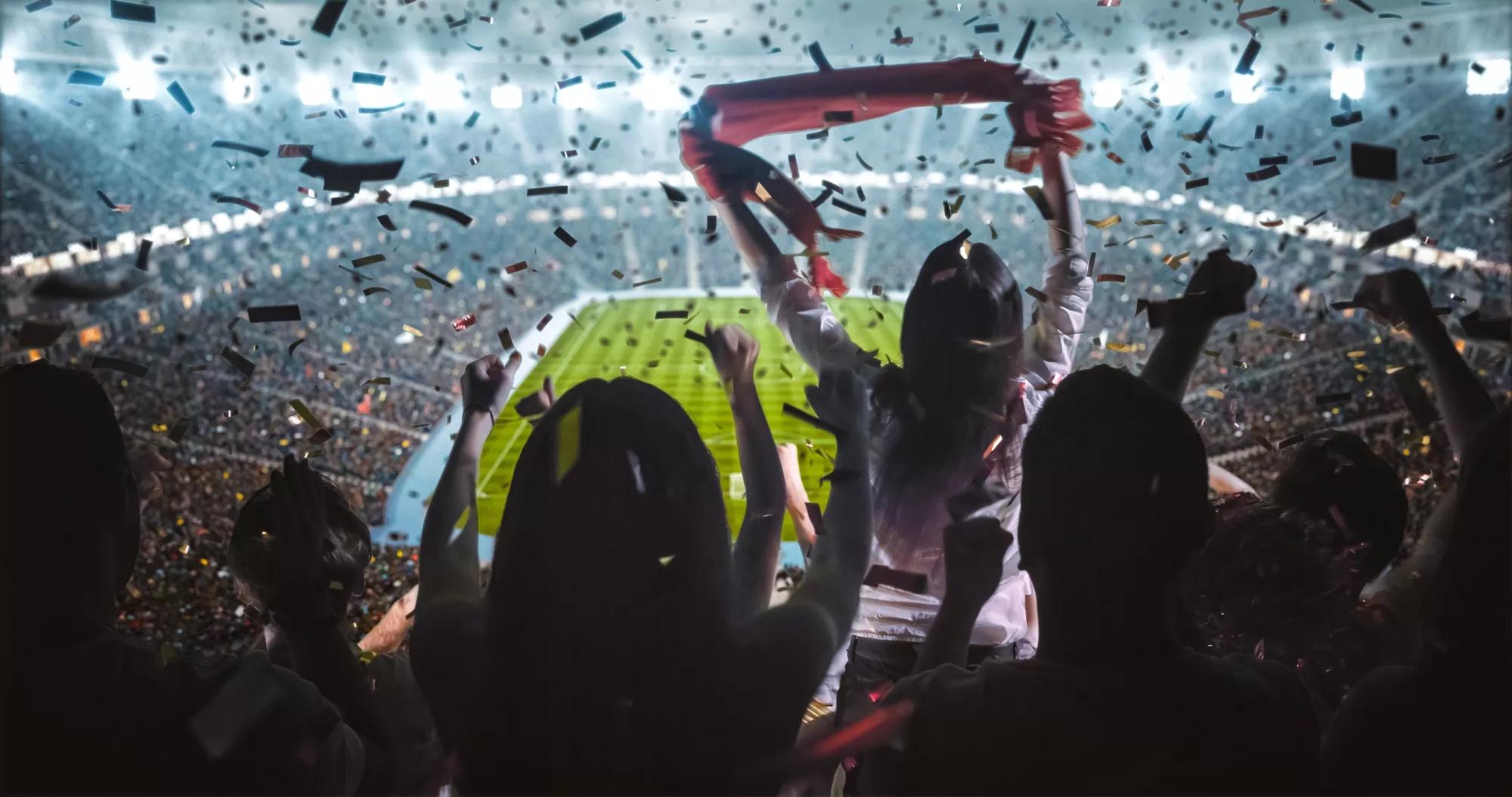 Group of fans are cheering for their team victory