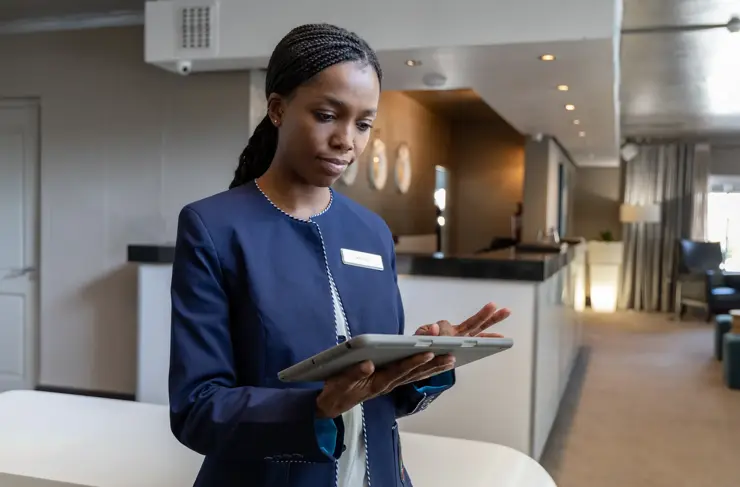 Female hotel manager using digital tablet