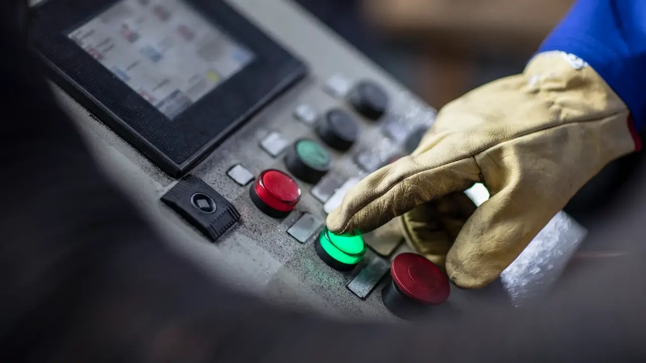hand operating control panel in factory